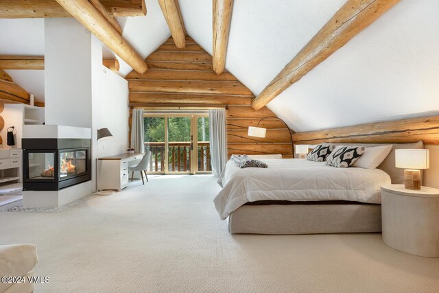 carpeted bedroom with beamed ceiling, a multi sided fireplace, high vaulted ceiling, and access to outside