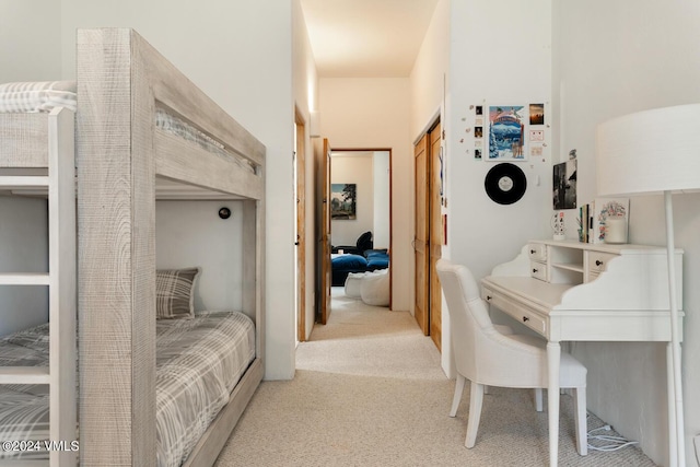 carpeted bedroom with a closet