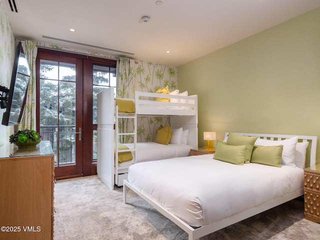 carpeted bedroom featuring wallpapered walls, recessed lighting, visible vents, and baseboard heating