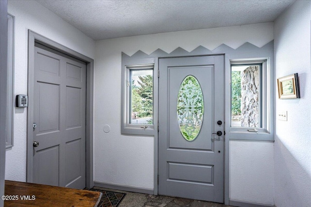 780 Deer Blvd, Avon, CO 81620 - entrance foyer with a textured ceiling and baseboards