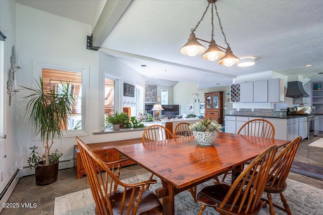 780 Deer Blvd, Avon, CO 81620 - dining room with a baseboard radiator and a textured ceiling