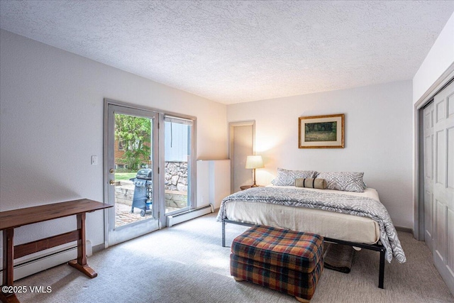 780 Deer Blvd, Avon, CO 81620 - bedroom with carpet, access to outside, a baseboard heating unit, and a textured ceiling