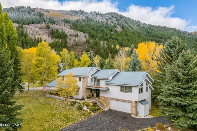 780 Deer Blvd, Avon, CO 81620 - view from above of property featuring a heavily wooded area and a mountainous background