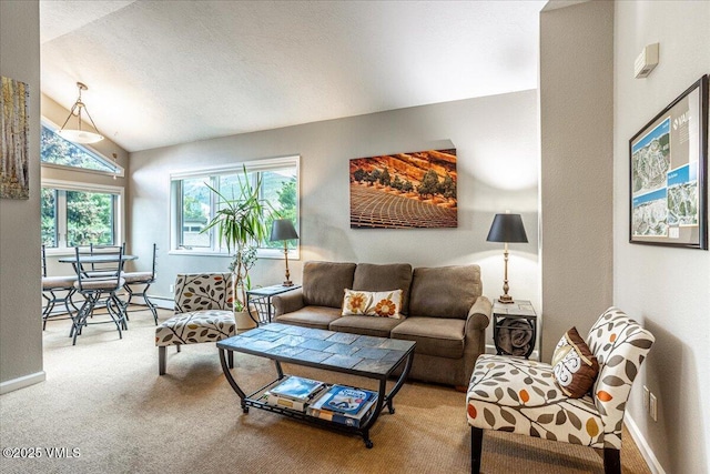 780 Deer Blvd, Avon, CO 81620 - carpeted living area with vaulted ceiling and baseboards