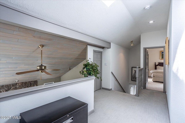 780 Deer Blvd, Avon, CO 81620 - hallway with vaulted ceiling, an upstairs landing, carpet flooring, and recessed lighting