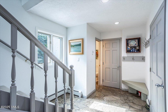 780 Deer Blvd, Avon, CO 81620 - entrance foyer with stone tile flooring, a textured ceiling, stairway, and recessed lighting