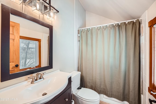 bathroom with toilet, vaulted ceiling, a shower with curtain, and vanity