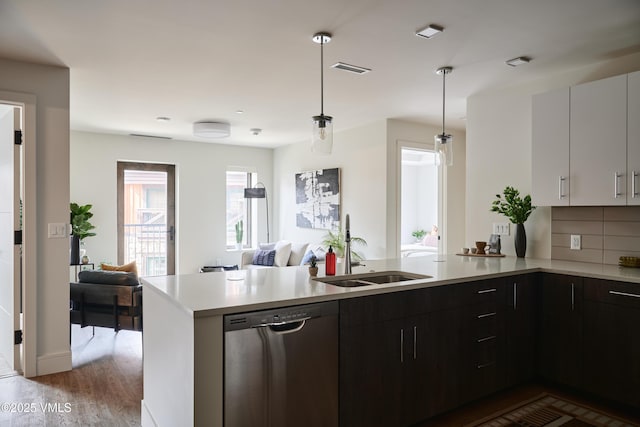 430 S Frontage Rd E Ru-D, Unit Ru-D Vail, CO 81657 - kitchen featuring dishwasher, light countertops, a peninsula, open floor plan, and decorative light fixtures