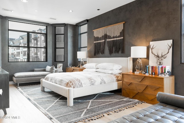 bedroom with light wood-type flooring