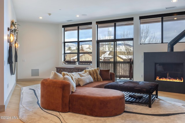 living room with light hardwood / wood-style flooring