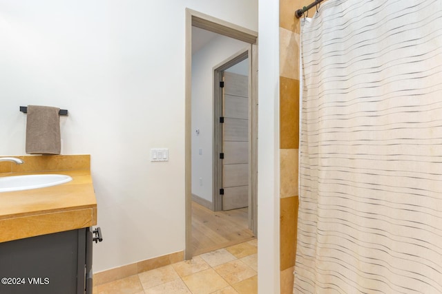 bathroom with vanity, a shower with curtain, and tile patterned floors