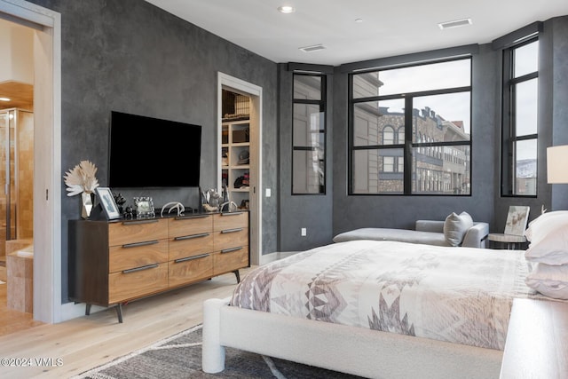 bedroom featuring light wood-type flooring