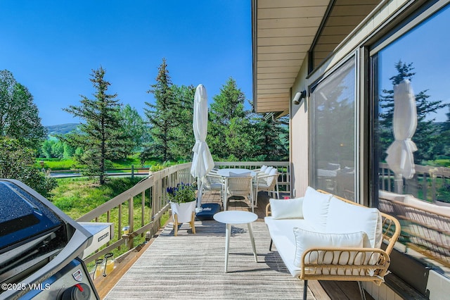 8 Charolais Cir, Edwards, CO 81632 - wooden deck featuring outdoor dining space and a mountain view