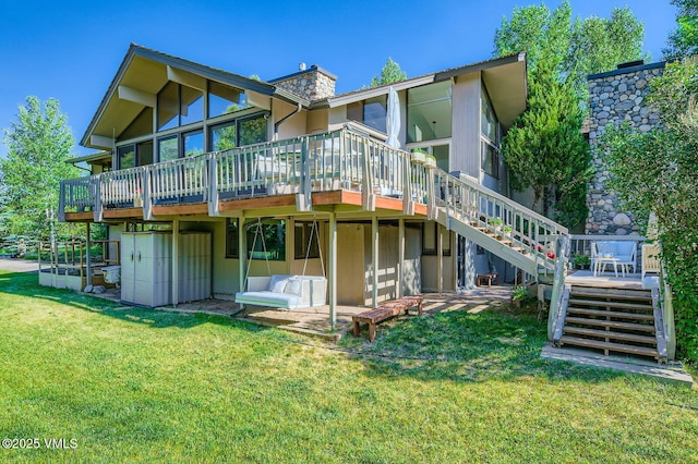 8 Charolais Cir, Edwards, CO 81632 - rear view of property with stairs, a wooden deck, a lawn, and a chimney