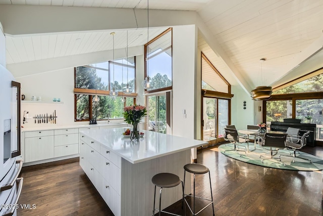 8 Charolais Cir, Edwards, CO 81632 - kitchen with white cabinetry, dark wood-style flooring, healthy amount of natural light, high vaulted ceiling, and a wood ceiling with exposed beams