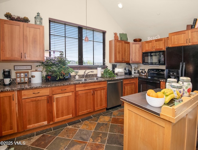 75 Aster Ct, Eagle, CO 81631 - kitchen featuring black appliances, stone tile flooring, high vaulted ceiling, brown cabinetry, and recessed lighting