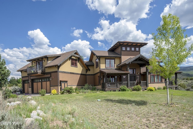 75 Aster Ct, Eagle, CO 81631 - view of front of house featuring a balcony, a front lawn, and a garage