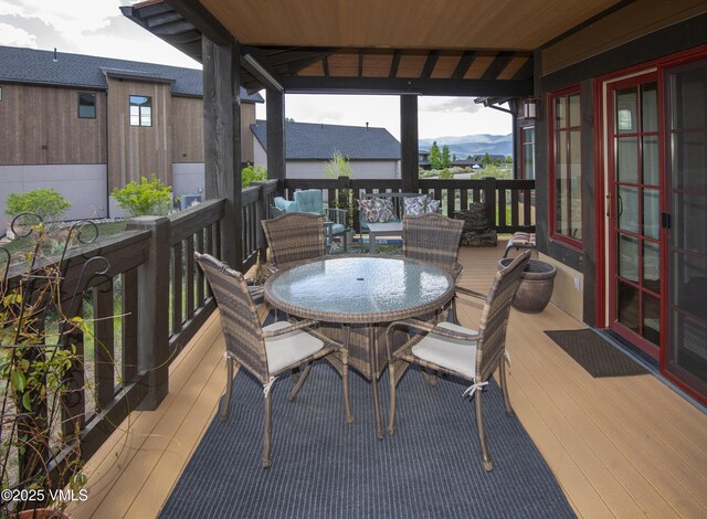 75 Aster Ct, Eagle, CO 81631 - stairs featuring wood-type flooring, a towering ceiling, and a chandelier