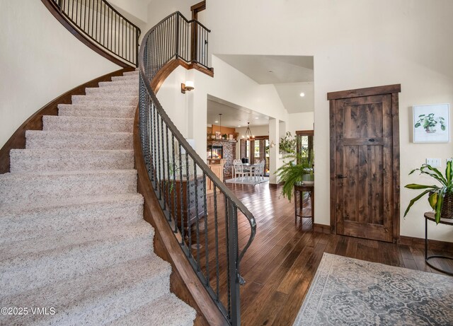 75 Aster Ct, Eagle, CO 81631 - staircase with a towering ceiling, a chandelier, and carpet