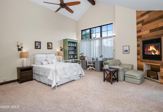 75 Aster Ct, Eagle, CO 81631 - carpeted bedroom with high vaulted ceiling, beamed ceiling, a tiled fireplace, and a ceiling fan