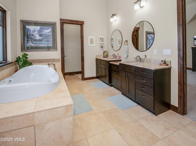 75 Aster Ct, Eagle, CO 81631 - bathroom with vanity, a garden tub, tile patterned flooring, and radiator heating unit