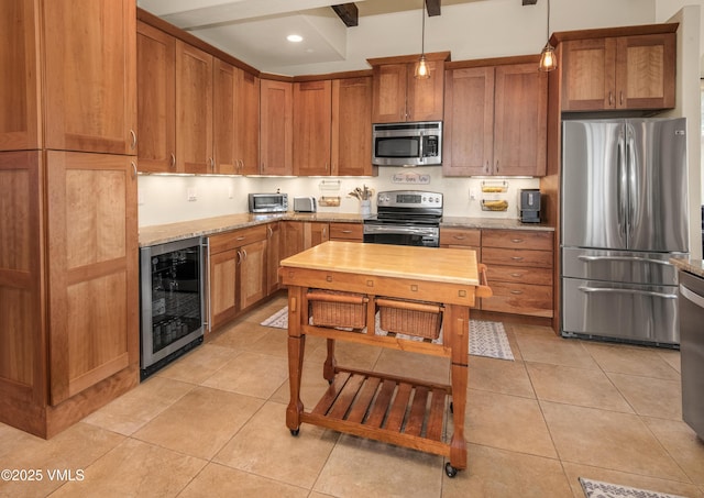 75 Aster Ct, Eagle, CO 81631 - kitchen with stainless steel appliances, wine cooler, brown cabinets, and light stone counters