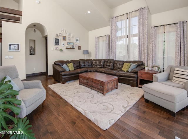 75 Aster Ct, Eagle, CO 81631 - living room featuring arched walkways, lofted ceiling, dark wood-type flooring, and recessed lighting