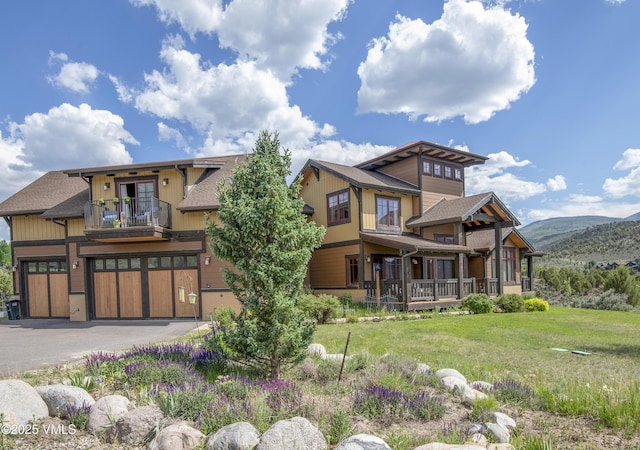 75 Aster Ct, Eagle, CO 81631 - view of front of property with an attached garage, a balcony, a front yard, and a shingled roof