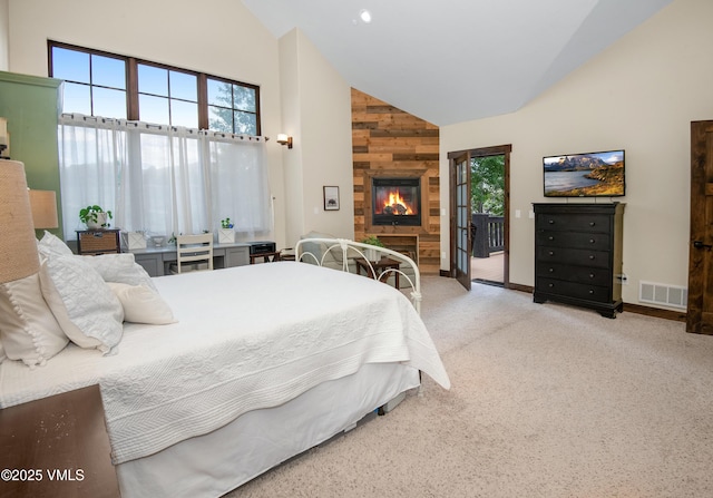 75 Aster Ct, Eagle, CO 81631 - bedroom with high vaulted ceiling, access to exterior, a large fireplace, carpet, and wooden walls