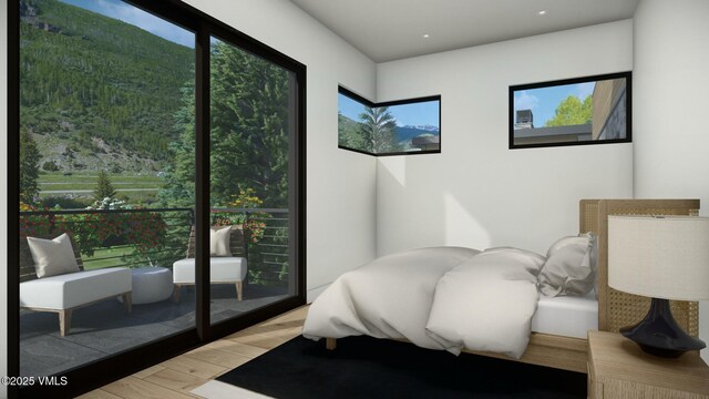 bedroom featuring light wood-style floors