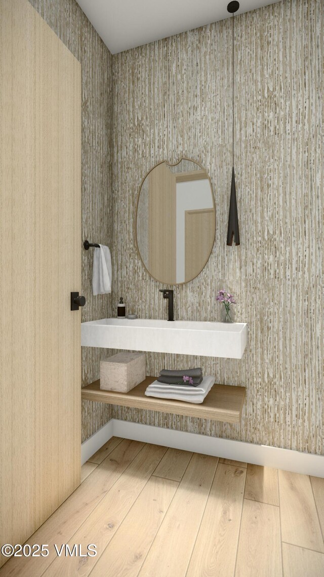 bathroom with hardwood / wood-style flooring