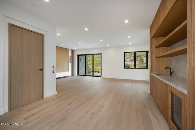 1487 Vail Valley Dr, Vail, CO 81657 - unfurnished living room with light wood-style flooring and recessed lighting