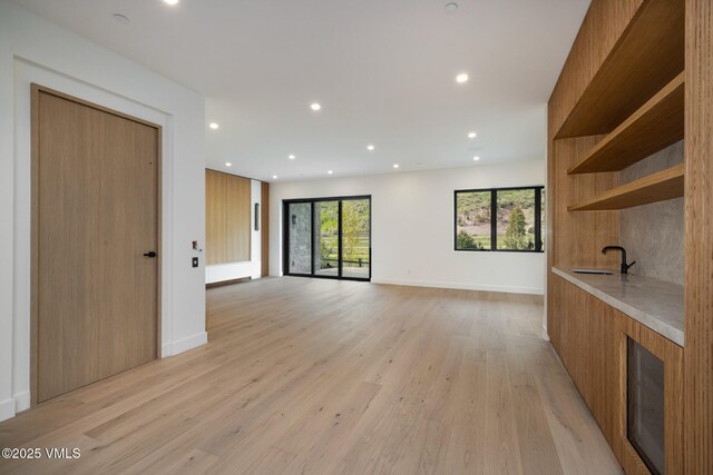 1487 Vail Valley Dr, Vail, CO 81657 - unfurnished living room featuring light wood-type flooring and recessed lighting