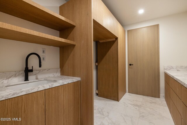 1487 Vail Valley Dr, Vail, CO 81657 - bar featuring a sink and light marble finish flooring