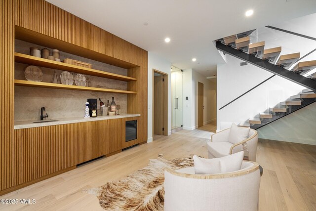 1487 Vail Valley Dr, Vail, CO 81657 - bar area featuring stairway, light wood-type flooring, and recessed lighting