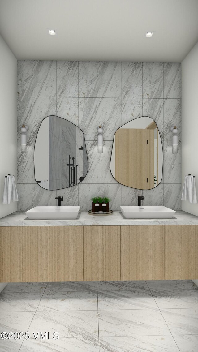 bathroom with double vanity, a sink, and recessed lighting