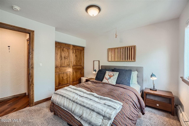3078 Wildridge Rd Unit D, Avon, CO 81620 - carpeted bedroom with a baseboard heating unit and a closet