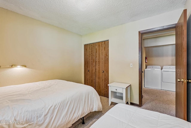 2540 Kinnikinnick Rd Unit G-2, Vail, CO 81657 - bedroom featuring carpet floors, washer and clothes dryer, a closet, and a textured ceiling