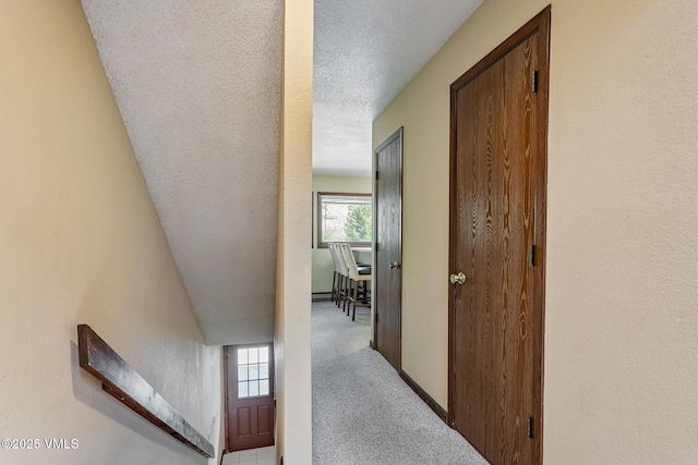 2540 Kinnikinnick Rd Unit G-2, Vail, CO 81657 - hallway with carpet flooring and a textured ceiling