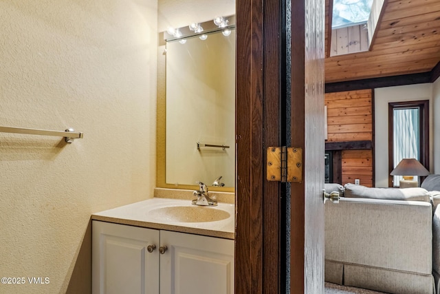 2540 Kinnikinnick Rd Unit G-2, Vail, CO 81657 - bathroom featuring a textured wall and vanity