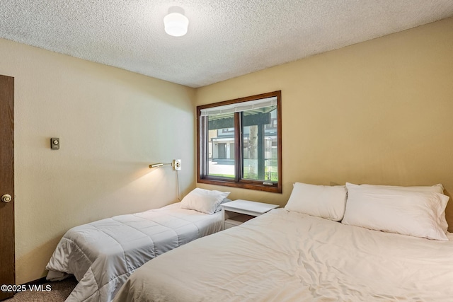 2540 Kinnikinnick Rd Unit G-2, Vail, CO 81657 - bedroom with a textured ceiling