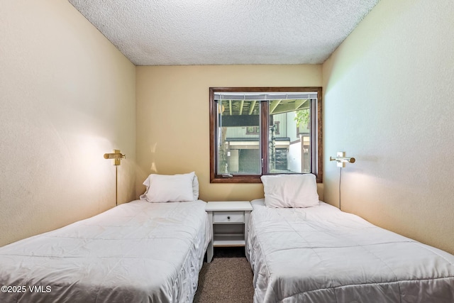 2540 Kinnikinnick Rd Unit G-2, Vail, CO 81657 - bedroom featuring carpet floors and a textured ceiling