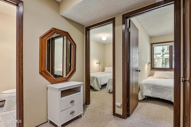 2540 Kinnikinnick Rd Unit G-2, Vail, CO 81657 - bedroom featuring a textured ceiling and light colored carpet