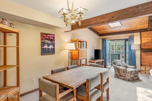 2540 Kinnikinnick Rd Unit G-2, Vail, CO 81657 - dining area featuring carpet floors, a skylight, a chandelier, and beamed ceiling