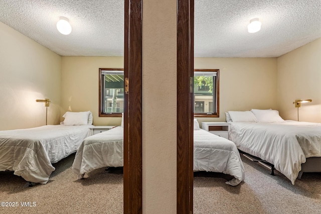 2540 Kinnikinnick Rd Unit G-2, Vail, CO 81657 - bedroom with a textured ceiling and carpet flooring