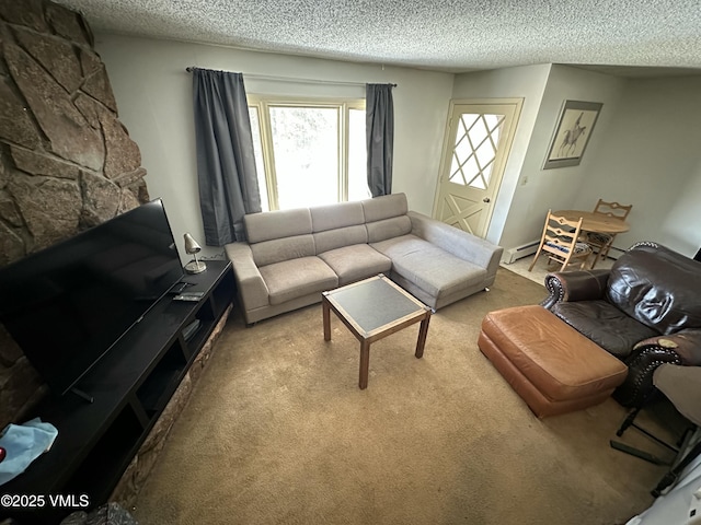 living area with a fireplace, carpet flooring, a baseboard heating unit, and a textured ceiling