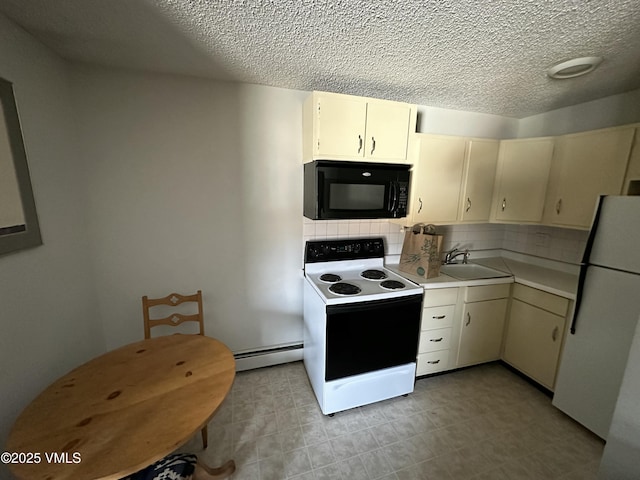 kitchen with freestanding refrigerator, decorative backsplash, black microwave, baseboard heating, and electric range oven