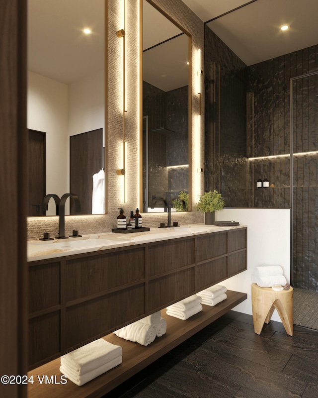 bathroom with a sink, decorative backsplash, and double vanity