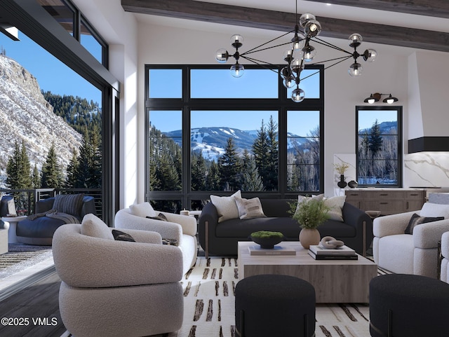 living area featuring high vaulted ceiling, a mountain view, a notable chandelier, light wood-type flooring, and beamed ceiling