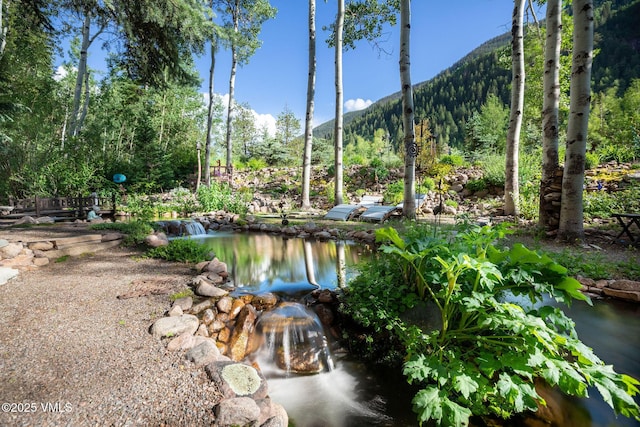 4240 Spruce Way, Vail, CO 81657 - water view featuring a mountain backdrop
